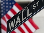 A Wall Street street sign in front of the New York Stock Exchange (NYSE) in New York, US, on Wednesday, July 31, 2024. 