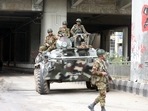 Bangladeshi Army soldiers patrol on the street after the government imposed a new curfew, in Dhaka. (PTI)