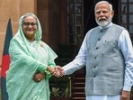 India's Prime Minister Narendra Modi with his Bangladesh's counterpart Sheikh Hasina (L) in New Delhi. (PTI file) India's Prime Minister Narendra Modi with his Bangladesh's counterpart Sheikh Hasina (L) in New Delhi. (PTI file)