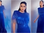 Karisma Kapoor will forever be the IT girl. She’s one of those actresses who seems to be ageing in reverse, becoming more stunning as the days go by. Whether she’s rocking a mini dress or a bossy pantsuit, she nails every look effortlessly. Karisma’s social media is brimming with fashion inspiration, and her Insta-diaries is a goldmine for her fans. Her latest appearance in a blue embellished gown is no different and is sure to steal your heart.(Instagram/@therealkarismakapoor)