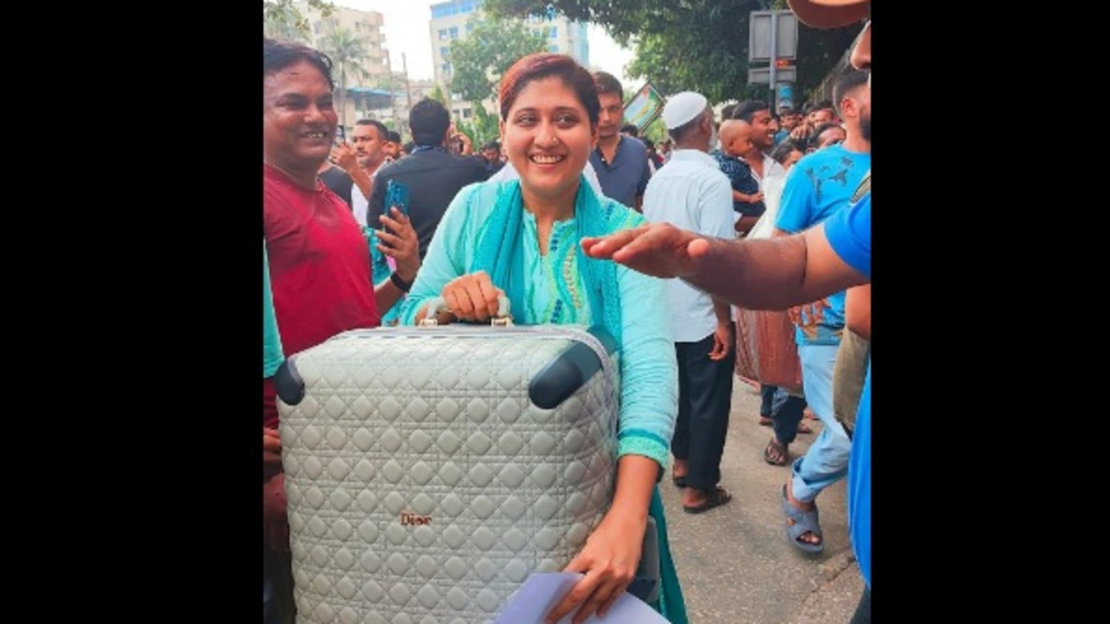 Woman loots Dior suitcase from Sheikh Hasina’s house in Bangladesh amid protest. Viral photo