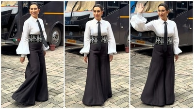 Karisma Kapoor is a fashion icon in her own right, and her latest look is no exception. She rocked a white shirt with balloon sleeves, styled with a black tie, a broad belt, and extra-flared black pants. With glamorous makeup, a neat bun and stud earrings, she exudes effortless oomph. (HT photo/VarinderChawla) Karisma Kapoor is a fashion icon in her own right, and her latest look is no exception. She rocked a white shirt with balloon sleeves, styled with a black tie, a broad belt, and extra-flared black pants. With glamorous makeup, a neat bun and stud earrings, she exudes effortless oomph. (HT photo/VarinderChawla)