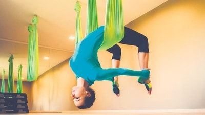 3. Aerial Yoga: Aerial yoga uses silk fabric or a hammock suspended from the ceiling to blend classic yoga positions with aerial acrobatics. This type of training gives you a unique full-body workout while you navigate in the air, improving flexibility, balance and core strength. From absolute beginners to seasoned practitioners, aerial yoga programs accommodate all ability levels and provide a welcome variation from traditional floor-based yoga practices. It's a fantastic way to push yourself and experience weightlessness at the same time. (File Photo) 3. Aerial Yoga: Aerial yoga uses silk fabric or a hammock suspended from the ceiling to blend classic yoga positions with aerial acrobatics. This type of training gives you a unique full-body workout while you navigate in the air, improving flexibility, balance and core strength. From absolute beginners to seasoned practitioners, aerial yoga programs accommodate all ability levels and provide a welcome variation from traditional floor-based yoga practices. It's a fantastic way to push yourself and experience weightlessness at the same time. (File Photo)