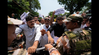 Activists of the Peoples Democratic Party raise slogans during a protest marking the fifth anniversary of abrogation of Article 370 in Jammu on Monday. (AP) Activists of the Peoples Democratic Party raise slogans during a protest marking the fifth anniversary of abrogation of Article 370 in Jammu on Monday. (AP)