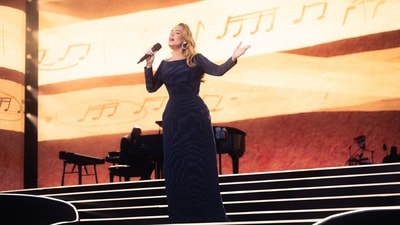 Adele received backlash for the use of the Rising Sun Flag at the concert in Germany. (@Adele/X)