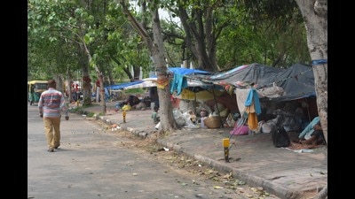 Beggars have set up illegal hutments along the VIP entry road of Mansa Devi Temple in Panchkula. (Sant Arora/HT) Beggars have set up illegal hutments along the VIP entry road of Mansa Devi Temple in Panchkula. (Sant Arora/HT)
