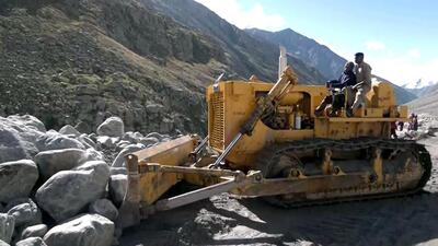 Boulders being removed from the Leh-Manali highway that got blocked due to a cloudburst in Lahaul and Spiti on Sunday. (ANI Photo)