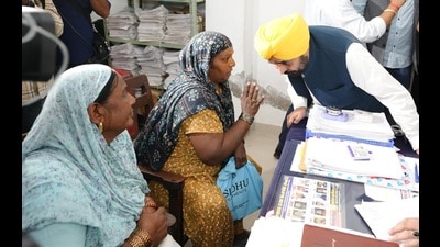 Chief minister Bhagwant Mann interacting with visitors at the tehsil complex in Rajpura, Patiala district, on Monday. (HT photo)