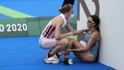 Claire Michel (right) fell ill after competing in the women's triathlon on Wednesday, which included swimming in the Seine River. (.AP) Claire Michel (right) fell ill after competing in the women's triathlon on Wednesday, which included swimming in the Seine River. (.AP)