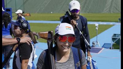 India's Maheshwari Chauhan (C) and Anant Jeet Singh Naruka leave after the skeet mixed team event. (AP) India's Maheshwari Chauhan (C) and Anant Jeet Singh Naruka leave after the skeet mixed team event. (AP)