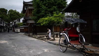 People visit the popular tourist destination of Miyajima island in Hiroshima Prefecture. (Photo by Philip FONG / AFP) People visit the popular tourist destination of Miyajima island in Hiroshima Prefecture. (Photo by Philip FONG / AFP)