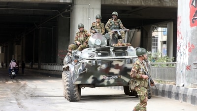 Bangladeshi Army soldiers patrol on the street after the government imposed a new curfew, in Dhaka. (PTI) Bangladeshi Army soldiers patrol on the street after the government imposed a new curfew, in Dhaka. (PTI)