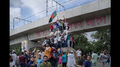 People celebrate following the resignation of Bangladesh Prime Minister Sheikh Hasina, in Dhaka, Bangladesh, on Monday, Aug. 5, 2024. Photographer: Febeha Monir/Bloomberg (Bloomberg) People celebrate following the resignation of Bangladesh Prime Minister Sheikh Hasina, in Dhaka, Bangladesh, on Monday, Aug. 5, 2024. Photographer: Febeha Monir/Bloomberg (Bloomberg)