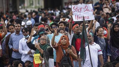 People shout slogans as they take part in a protest rally in Dhaka on Monday. (AP Photo) People shout slogans as they take part in a protest rally in Dhaka on Monday. (AP Photo)