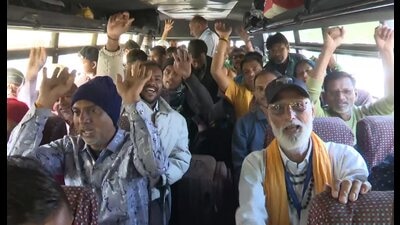 Pilgrims raise slogans as they leave for the holy cave shrine of Amarnath, in Srinagar. (PTI)