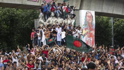 Protesters celebrate in Dhaka after Prime Minister Sheikh Hasina's resignation on Monday. (AP Photo) Protesters celebrate in Dhaka after Prime Minister Sheikh Hasina's resignation on Monday. (AP Photo)