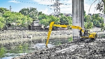 MCD officials clear the Barapullah drain near Nizamuddin on Sunday MCD officials clear the Barapullah drain near Nizamuddin on Sunday