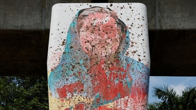 A mural of Bangladeshi Ex Prime Minister Sheikh Hasina is seen vandalised by protesters in Dhaka, Bangladesh (REUTERS)