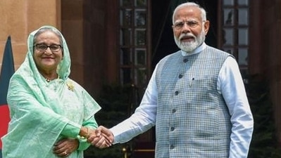 India's Prime Minister Narendra Modi with his Bangladesh's counterpart Sheikh Hasina (L) in New Delhi. (PTI file) India's Prime Minister Narendra Modi with his Bangladesh's counterpart Sheikh Hasina (L) in New Delhi. (PTI file)