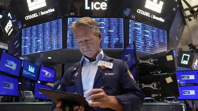 Trader Robert Charmak works on the floor of the New York Stock Exchange, Monday, Aug. 5, 2024. Nearly everything on Wall Street is tumbling as fear about a slowing U.S. economy worsens and sets off another sell-off for financial markets around the world. (AP) Trader Robert Charmak works on the floor of the New York Stock Exchange, Monday, Aug. 5, 2024. Nearly everything on Wall Street is tumbling as fear about a slowing U.S. economy worsens and sets off another sell-off for financial markets around the world. (AP)