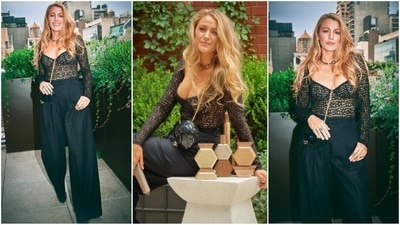 For her latest look, Blake wore a black sweetheart neckline sheer top with full sleeves, embellished with black floral detailing. She paired it with matching high-waisted flared pants and carried a black rose sling bag. She looked absolutely stunning. (Instagram/@blakelively) For her latest look, Blake wore a black sweetheart neckline sheer top with full sleeves, embellished with black floral detailing. She paired it with matching high-waisted flared pants and carried a black rose sling bag. She looked absolutely stunning. (Instagram/@blakelively)