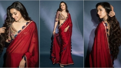 Shraddha Kapoor's recent saree look is the epitome of ethnic fashion goals. The stunning red saree features a striking blue border, and she paired it with an embellished multicolor sweetheart neckline blouse. She looks absolutely gorgeous in this elegant ensemble. (Instagram/@shraddhakapoor) Shraddha Kapoor's recent saree look is the epitome of ethnic fashion goals. The stunning red saree features a striking blue border, and she paired it with an embellished multicolor sweetheart neckline blouse. She looks absolutely gorgeous in this elegant ensemble. (Instagram/@shraddhakapoor)