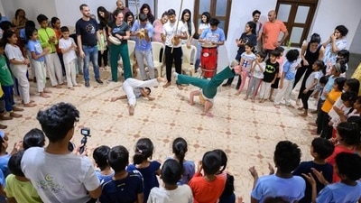 5. Capoeira: Brazilian martial art capoeira is a fluid and rhythmic movement technique that incorporates dance, acrobatics, and music. Its fluid kicks, spins, and sweeps set to the rhythm of traditional Brazilian instruments like the berimbau define it. Capoeira develops creativity and a respect for culture in addition to physical conditioning, flexibility, and reflexes. Partner exercises, music lessons, and games (called "jogos") are common in classes, which foster a lively and supportive environment. (File Photo) 5. Capoeira: Brazilian martial art capoeira is a fluid and rhythmic movement technique that incorporates dance, acrobatics, and music. Its fluid kicks, spins, and sweeps set to the rhythm of traditional Brazilian instruments like the berimbau define it. Capoeira develops creativity and a respect for culture in addition to physical conditioning, flexibility, and reflexes. Partner exercises, music lessons, and games (called "jogos") are common in classes, which foster a lively and supportive environment. (File Photo)