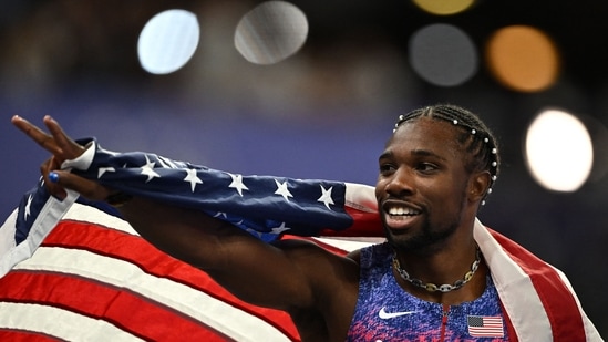 US' Noah Lyles reacts after crossing the finish line in first place, winning the men's 100m final of the athletics event at the Paris 2024 Olympic Games at Stade de France in Saint-Denis, north of Paris, on August 4, 2024. (Photo by Ben STANSALL / AFP)