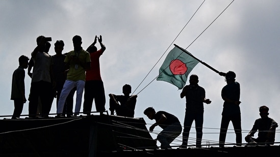 Anti-government protestors celebrate in Shahbag near Dhaka university area in Dhaka on August 5, 2024. (AFP)