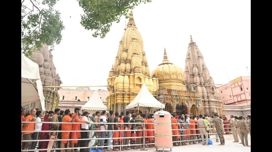 Devotees queue up at Kashi Vishwanath temple on Monday. (Rajesh Kumar/ht)