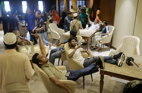 Anti-government protestors gather inside Prime Minister Sheikh Hasina's palace in Dhaka. (AFP)