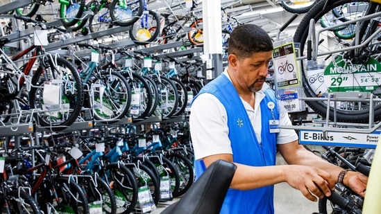 A worker organizes bicycles at a Walmart Superstore in Secaucus, New Jersey.(AP)