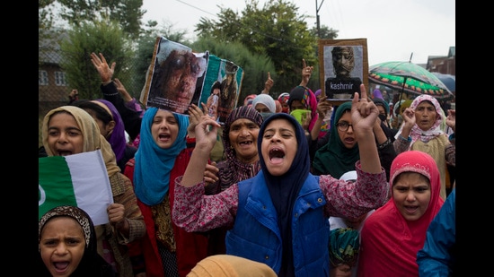 FILE-Kashmiris shout slogans during a protest after Friday prayers against the abrogation of article 370, on the outskirts of Srinagar, Indian controlled Kashmir, Oct. 4, 2019. (AP Photo/ Dar Yasin, File) (AP)