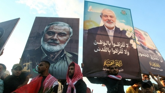 People take part in a march called by Palestinian and Lebanese youth organisations in the southern Lebanese city of Saida. (AFP)