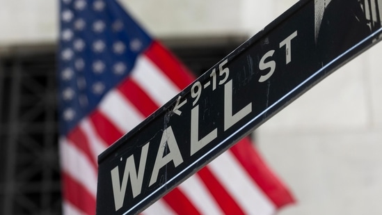 A Wall Street street sign in front of the New York Stock Exchange (NYSE) in New York, US, on Wednesday, July 31, 2024. (Bloomberg)