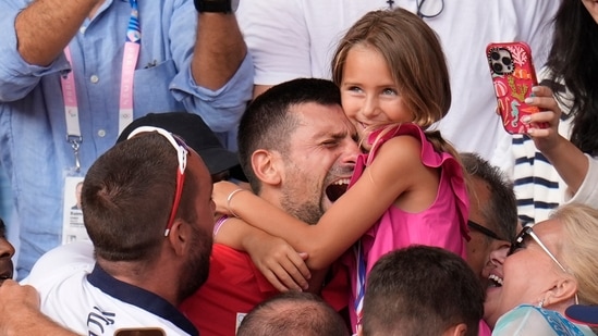 Serbia's Novak Djokovic embraces his daughter Tara after defeating Spain's Carlos Alcaraz