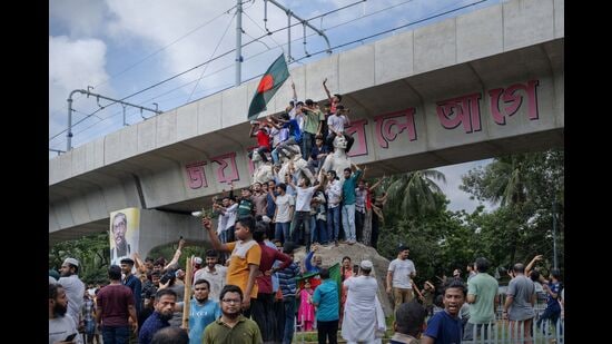 People celebrate following the resignation of Bangladesh Prime Minister Sheikh Hasina, in Dhaka, Bangladesh, on Monday, Aug. 5, 2024. Photographer: Febeha Monir/Bloomberg (Bloomberg)