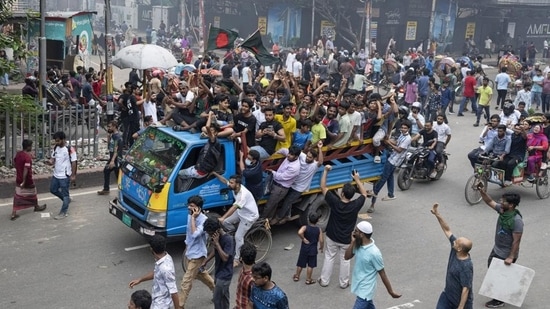 Protesters celebrate after news of Prime Minister Sheikh Hasina's resignation, in Dhaka, Bangladesh, on Monday. (AP)