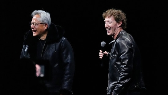 Nvidia chief executive officer Jensen Huang, left, laughs after exchanging jackets with Meta founder and CEO Mark Zuckerberg at SIGGRAPH 2024.(AP)