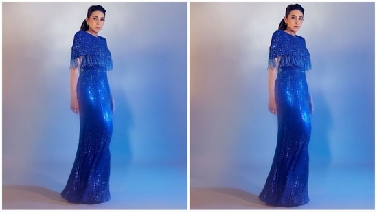 Karisma's gown is a breathtaking shade of blue, featuring intricate bead detailing, a round neck, short sleeves, a concealed rear zip fastening, and a floor-length hemline. The fringe sleeves, adorned with tonal bead embellishments throughout, add an extra oomph factor.(Instagram/@therealkarismakapoor)