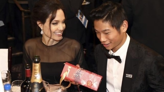 Angelina Jolie, left, and Pax Jolie-Pitt are seen at the Golden Globes. (AP)