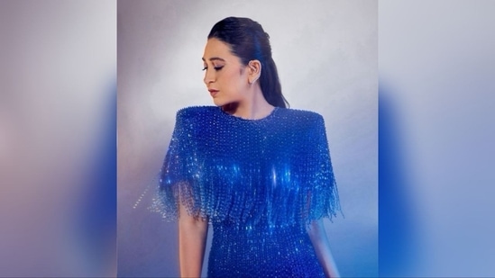 With the assistance of hairstylist Radhika Yadav, Karisma styled her luscious tresses into soft curls and left them loose in a half-updo hairstyle, adding a touch of sophistication.(Instagram/@therealkarismakapoor)