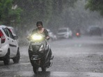 Commuters step out during evening rain at sector 12, in Noida, India, on Sunday, August 04, 2024. (Photo by Sunil Ghosh / Hindustan Times) 