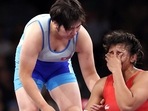 North Korea’s Sol Gum Pak consoles India's Nisha Dahiya during the women’s 68kg quarterfinal match in the Olympic Games Paris 2024, on Monday.
