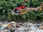 An Indian Air Force helicopter, in joint efforts with the Indian Army, during the seventh day of the rescue operation following landslides that led to massive damage in Wayanad district. (PTI) An Indian Air Force helicopter, in joint efforts with the Indian Army, during the seventh day of the rescue operation following landslides that led to massive damage in Wayanad district. (PTI)