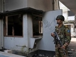 A soldier stands guard at the vandalised museum of Sheikh Mujibur Rahman, father of Sheikh Hasina who resigned as Prime Minister on Monday, in Dhaka, Bangladesh,(AP) A soldier stands guard at the vandalised museum of Sheikh Mujibur Rahman, father of Sheikh Hasina who resigned as Prime Minister on Monday, in Dhaka, Bangladesh,(AP)