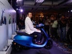 Bhavish Aggarwal, CEO of Ola Cabs, and founder of Ola Electric, sits on an Ola electric scooter after the press conference before the company's IPO launch in Mumbai. (Reuters)