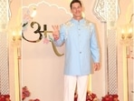 John Cena strikes a pose at the Ambani wedding in a light blue bandhagala kurta and white pants. He styled the look with tan brown dress shoes.(HT Photo/Varinder Chawla) John Cena strikes a pose at the Ambani wedding in a light blue bandhagala kurta and white pants. He styled the look with tan brown dress shoes.(HT Photo/Varinder Chawla)