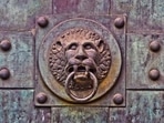 Representative image of a lion-faced door. Representative image of a lion-faced door.