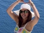 Kriti Sanon posed in her multi-coloured betted co-ord set during her birthday vacation at Greece a she celebrated her 33rd  birthday. She completed her look with a white hat and black sunglasses as she kept her hair loose. She made a love sign with her hands as she posted her last reel before returning to India. The actor was accompanied by sister Nupur Sanon and rumoured boyfriend Kabir Bahia. 